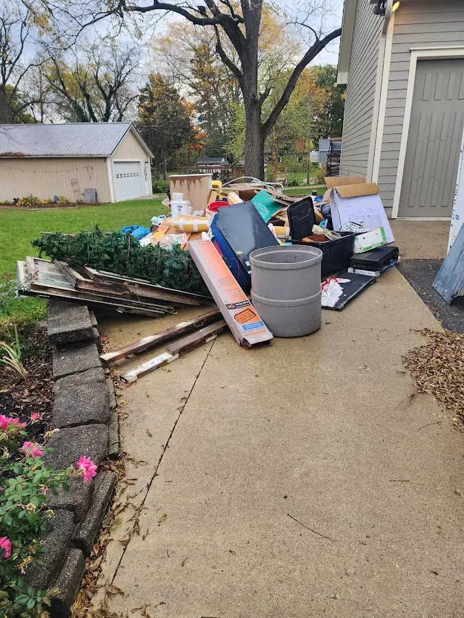 Dumpster being loaded with debris for 10 Yard Dumpster Rental in Tooele